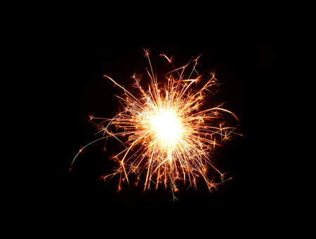 sparkler or firework on dark night backgroundの写真素材