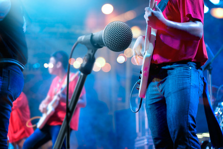 Guitarist and microphone on stage for background, soft and blur conceptの写真素材