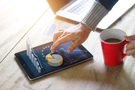 Business people using laptop and tablet of technology e-comerce internet global network connection marketing purchasing and business statistic growth graph, business success conceptの写真素材