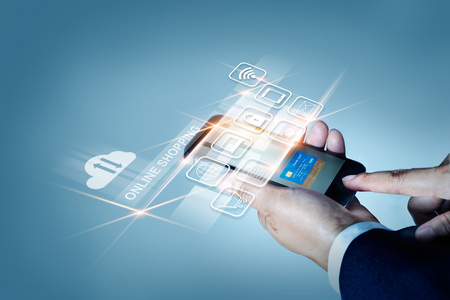 Businessman using mobile payments online shopping and icon customer network connection on screen, All on mobile screen are design up.の写真素材