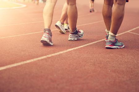 Athletics people walking exercise on the track field outdoor. Copy spaceの写真素材