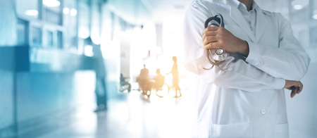 Healthcare and medical concept. Medicine doctor with stethoscope in hand and Patients come to the hospital background.の写真素材