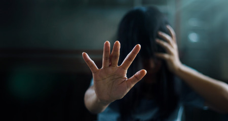 PTSD Mental health concept. Post Traumatic Stress Disorder. The depressed woman sitting alone on the...
