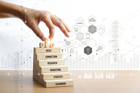 Hand of touching number one icons over wooden stair, Mobile payments, Digital marketing. Banking network. Online shopping and icon customer networking connection. Business technology, Marketing strategy business concept.の写真素材