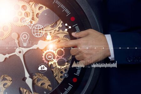 Abstract symbol, Businessman touching cog watch of innovation and technologies in futuristic. Time on creativity and development of modern business.の写真素材