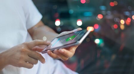 Online shopping and payment, Online banking, Man using smartphone and payment successful on screen colorful nightの写真素材