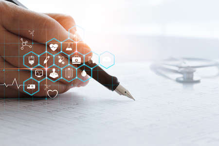 Hand of doctor analysis and record data information of patient, with healthcare and medical icon.の写真素材