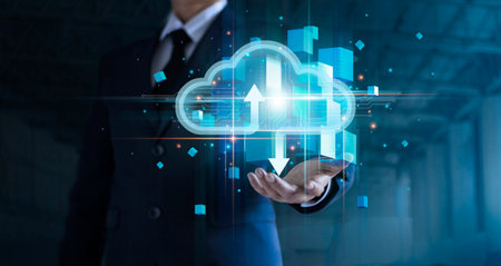 Businessman hand holding cloud computing online connecting to big data analytics. Block chain...