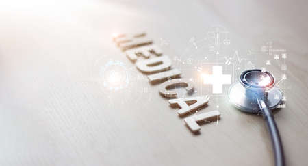 Stethoscope with icon healthcare and medical global network on wooden background.の写真素材