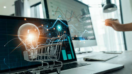 Abstract of digital marketing,  Glowing of light bulb in cart on laptop and icon digital marketing, Creative process and new idea, Strategy and planning of business, Online banking and payment.の写真素材