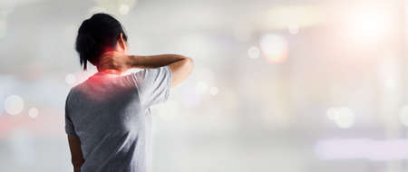 Woman tired exhausted and suffering with neck pain and shoulder pain, Healthcare and medical.の写真素材