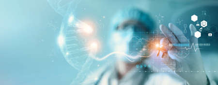 Abstract luminous DNA molecule. Hand of doctor touching and cut dna for checking with analysis chromosome DNA genetic of human on virtual interface. Medicine, Medical science and biotechnology.の写真素材