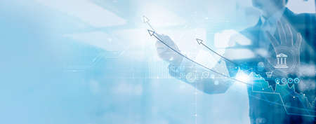 Business strategy and planning concept, Financial and banking, Businessman analyzing data and drawing graph growth planning of business and economy on office background.の写真素材