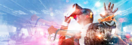 Metaverse Technology. Manager engineer use VR virtual reality goggle analyzing and control...