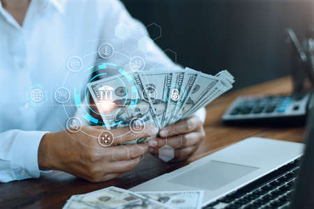 Businessman using laptop online banking and payment, Digital marketing. Finance and banking networking. Online shopping and icon customer network connection, cyber security. Business technology.の写真素材