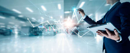 Businessman draw growth graph and progress of business and analyzing financial and investment data ,business planning and strategy, banking and stock market on office background.の写真素材