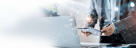 Digital marketing, Businessman using tablet analysis economy finance and sale data growth on interface icons, Banking, Finance, Business Strategy on global business network connection technology.の写真素材