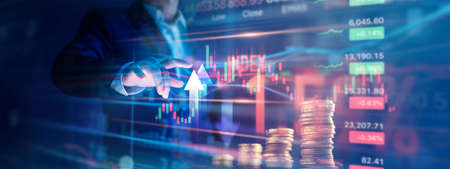 Businessman pointing arrow up with analyzing finance sales data and economic growth graph chart of financial by investment in valuable asset, Economy, Banking and stock market.の写真素材