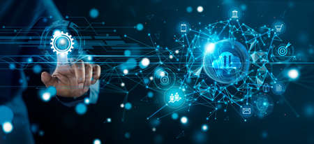 Businessman connect to global network and create a new approach to investment project and develop technology to improve business service. Communication networking and worldwide connection technology.の写真素材