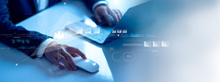 Businessman using laptop analyzing sales data and customer shopping behavior on economic growth graph chart. Business strategy plan. Social network and Digital marketing. Technology on global businessの写真素材