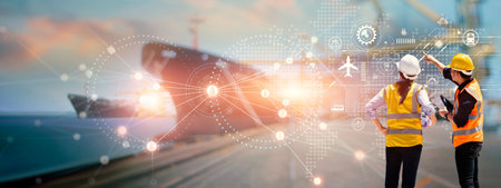 Engineers pointing virtual interface panel of global logistics network distribution and transportation, Smart logistics, Import export and industry, Technology and innovation future of transport.の写真素材