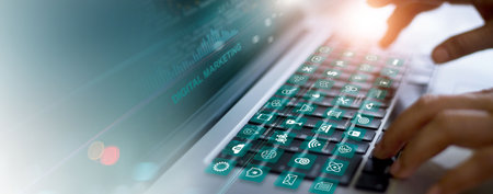 Digital online marketing, Businessman using laptop with marketing icon on keyboard and analysis sale data graph growth on interface, data science, Solution analysis and development on social networkの写真素材