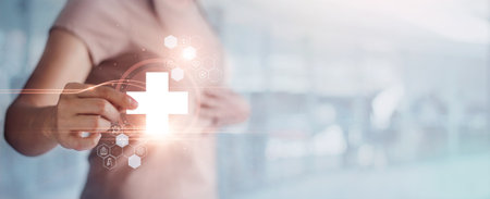 Woman holding virtual health care symbol and icons medical on interface People health care awareness rising growth of medical health and life insurance business.の写真素材