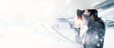 Business woman use metaverse VR technology analysing financial growth graph data on stock market investment. Innovation strategy in virtual reality for futuristic business success in global economy.の写真素材