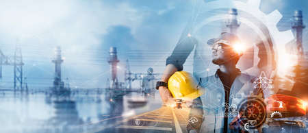 Professional industrial engineer with blueprints checking and analysis data of power plant station project on network connection  technology background, Engineering, inspector and architect.の写真素材