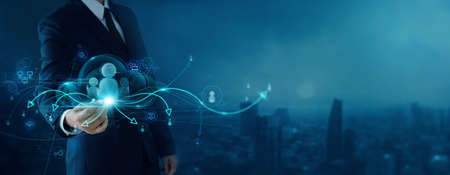 CRM. Customer network relationship management concept, Businessman hold of global structure customer network technology, Data exchanges development. customer service, Internet Business strategy.の写真素材