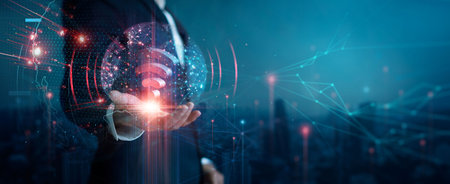 Businessman holding Global telecommunication network connection. Wireless Communication. Cyber technology and smart internet network modernization on dark blue cityscape background. 3D render.の写真素材