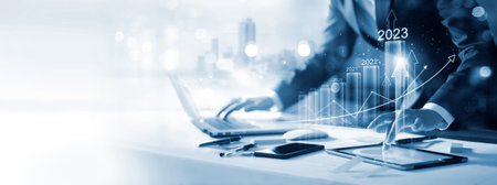 Goal of business new year in 2023, Investor, Businessman analysis economic and calculates financial data and target for long-term investments and profitability in future on digital data network.の写真素材