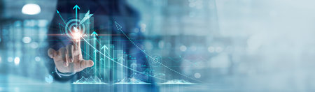 Businessman analyzing and calculating financial data for long term investment growth goals and company finance balance, Business strategy and planning of target. Economic analysis of Digital marketingの写真素材