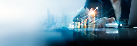 Businessman analyzing financial investment strategy with economic growth. Financial exchange rate, data analytic technology and banking network service develop profit stability for global business.の写真素材