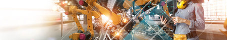 Engineer check and control welding robotics arm system for digital industry using software connected...