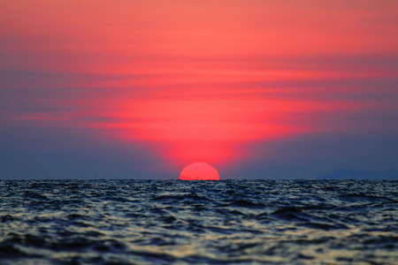 Sunset with beautiful light into the seaの写真素材