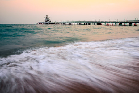 Beautiful wave with old bridgeの写真素材