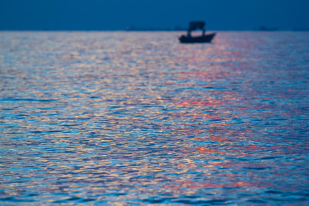 Beautiful sunset with boatの写真素材