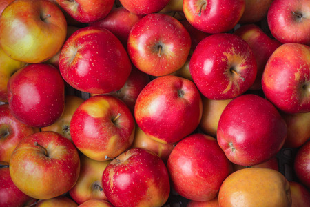 Fresh ripe red apples in a store as background