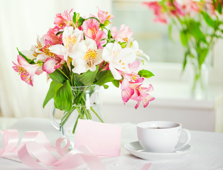 Happy Birthday with Beautiful bouquet of alstroemeria in a vase with water,  love and greeting conceptの写真素材