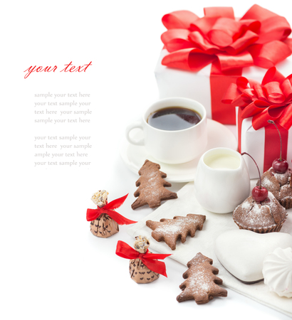 Sweets and gifts for the Christmas table, coffee, cookies, candy, cream and gifts on a white backgroundの写真素材