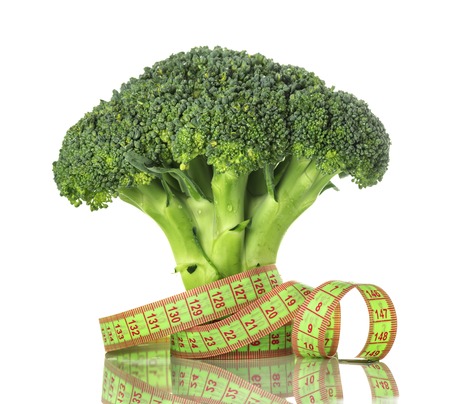 Broccoli and santimert closeup isolated on white background, concept of healthy eating and weight lossの写真素材