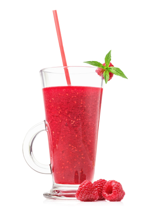 Fresh raspberry smoothies in a glass, blackberries and mint isolated on white background closeupの写真素材