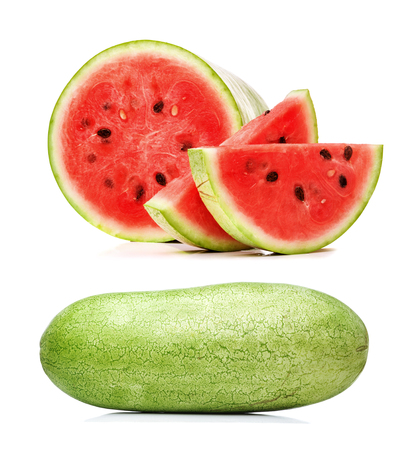 long watermelon and sliced pieces isolated on a white background closeupの写真素材