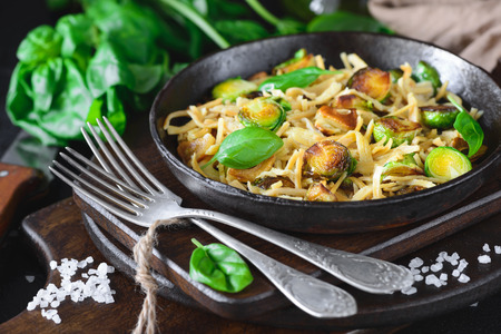Soy vermicelli, fried garlic, Brussels sproutsの写真素材