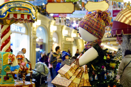 Inflatable doll Shopaholic with shopping in GUM. Christmas and new year saleのeditorial素材