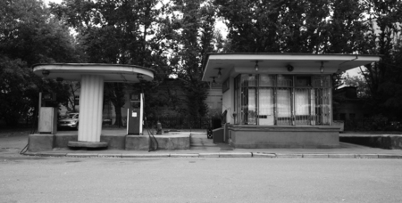 Black-and-white picture of an old gas station in the city centreの写真素材