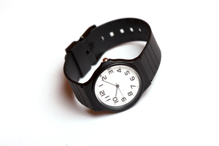 Classic black and white wrist watch on the white backgroundの写真素材