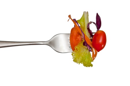  fresh red tomato and salad on a fork. Isolated の写真素材