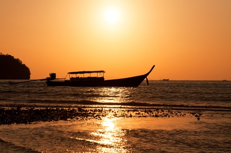  Longtail boat and sunset on Railay island, Krabi, Thailand の写真素材